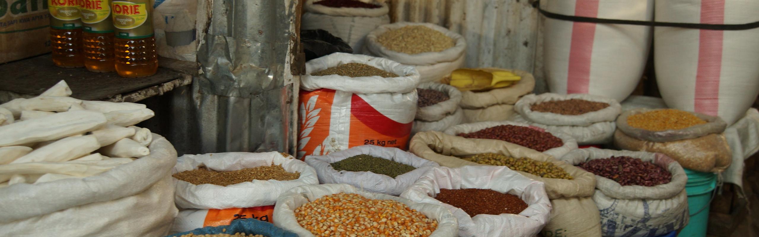 Bags of maize, beans, and rice in a market in Arusha, Tanzania