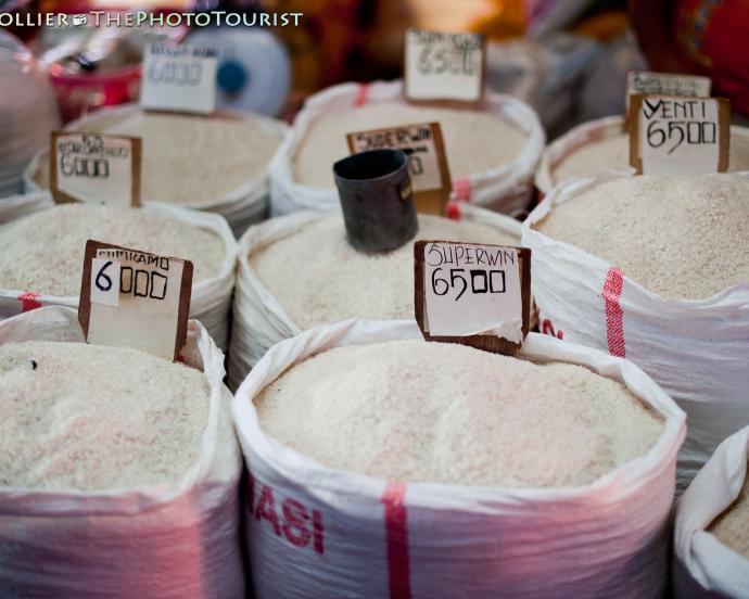 A vendor in Bitung's Aertembaga Market displays bags of rice for sale.