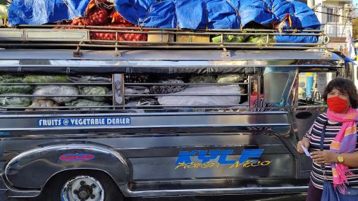 A dealer delivers fruits and vegetables from farm to market to keep the food supply amid the COVID-19 lockdown, Muntinlupa City, Philippines.