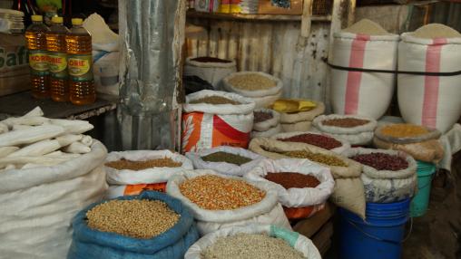Bags of maize, beans, and rice in a market in Arusha, Tanzania
